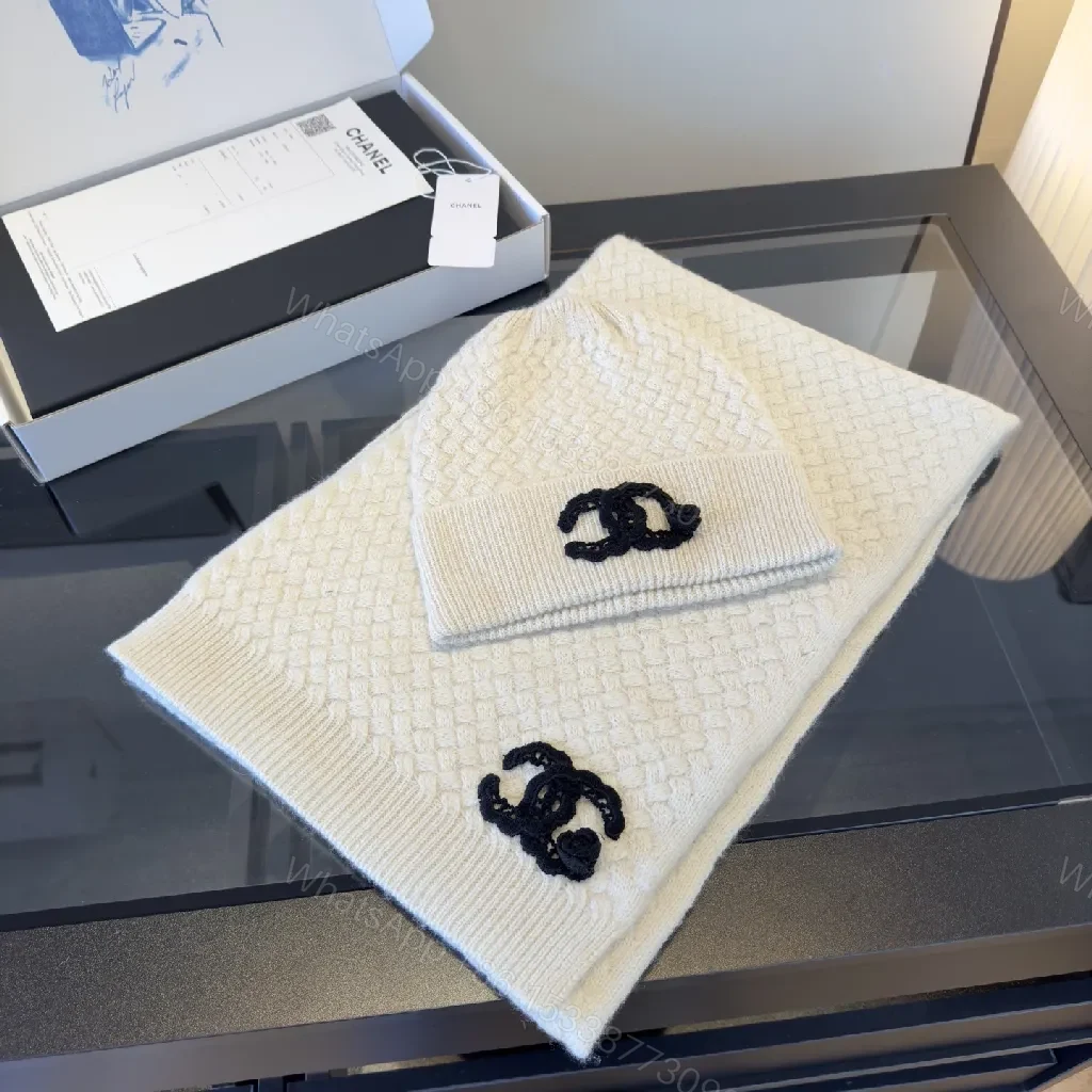 View 10 of Ivory Knit Set: Textured Luxury with Iconic Emblem