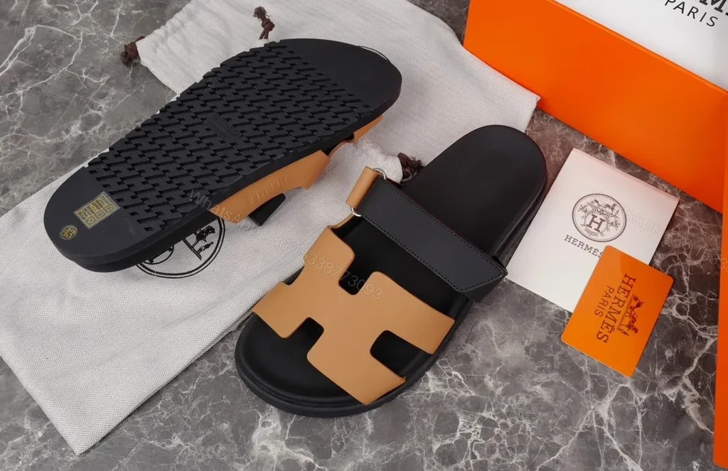 View 2 of Hermes Oran Leather Slides â€” H-Cutout, All-Day Comfort, Black/Tan