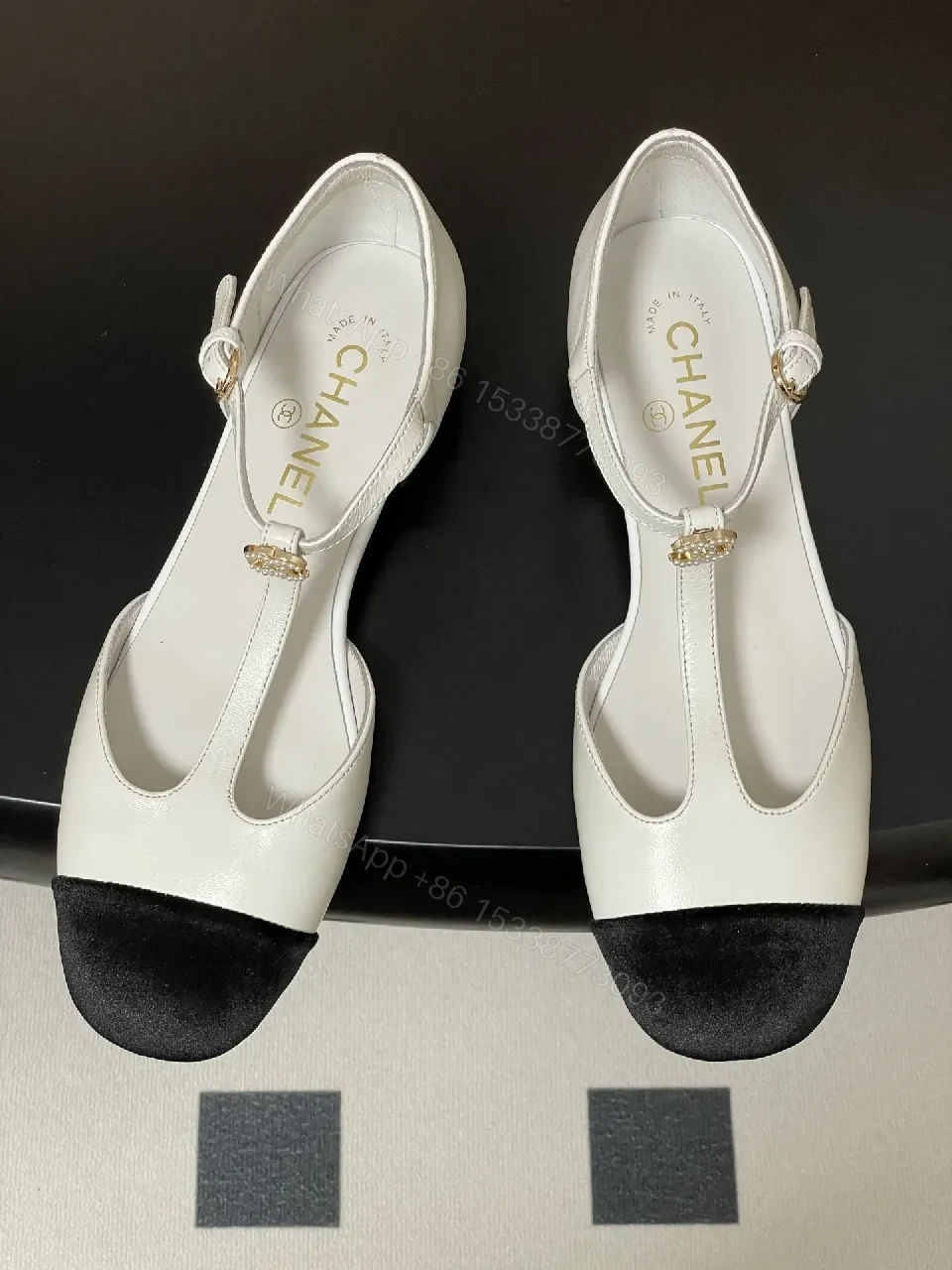 View 2 of White & Black T-Strap Pumps with Pearl Buckle – Luxe Two-Tone Heels