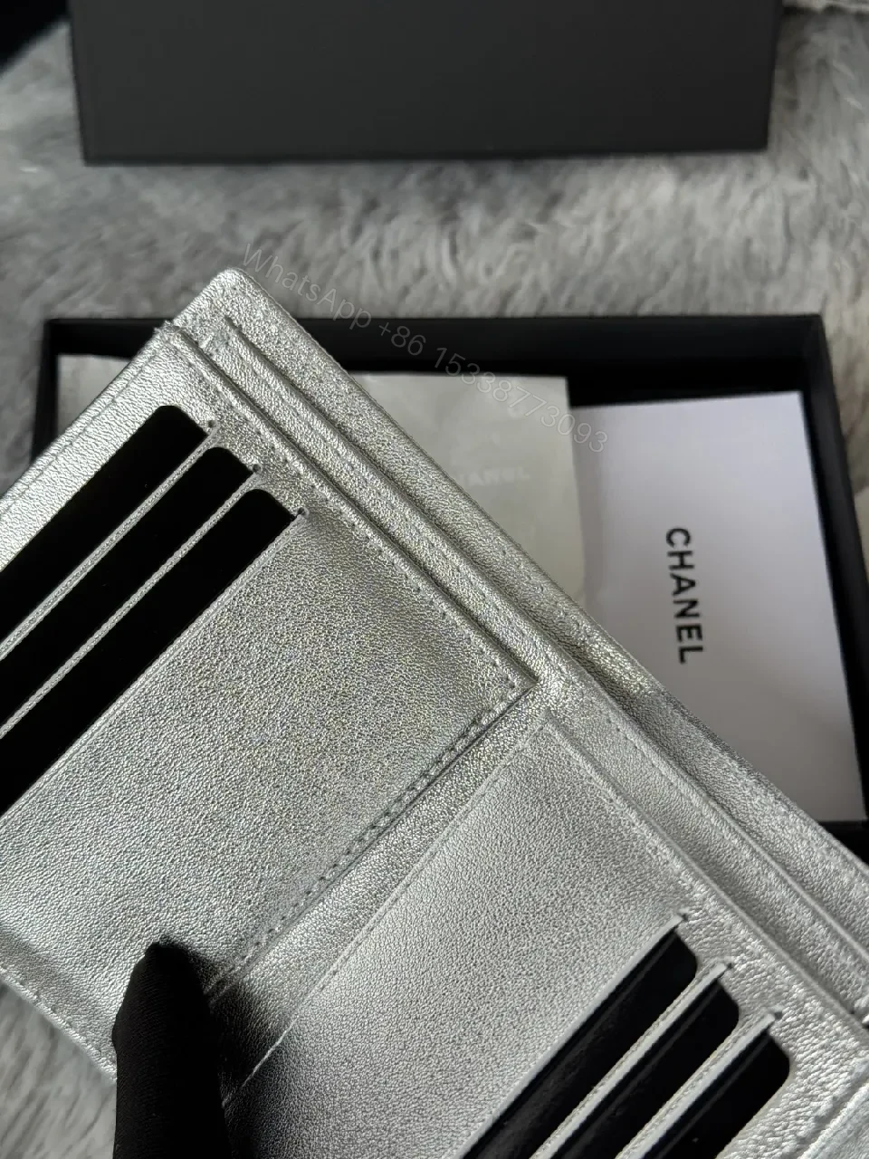 View 7 of Compact Silver Quilted Wallet with Signature Hardware