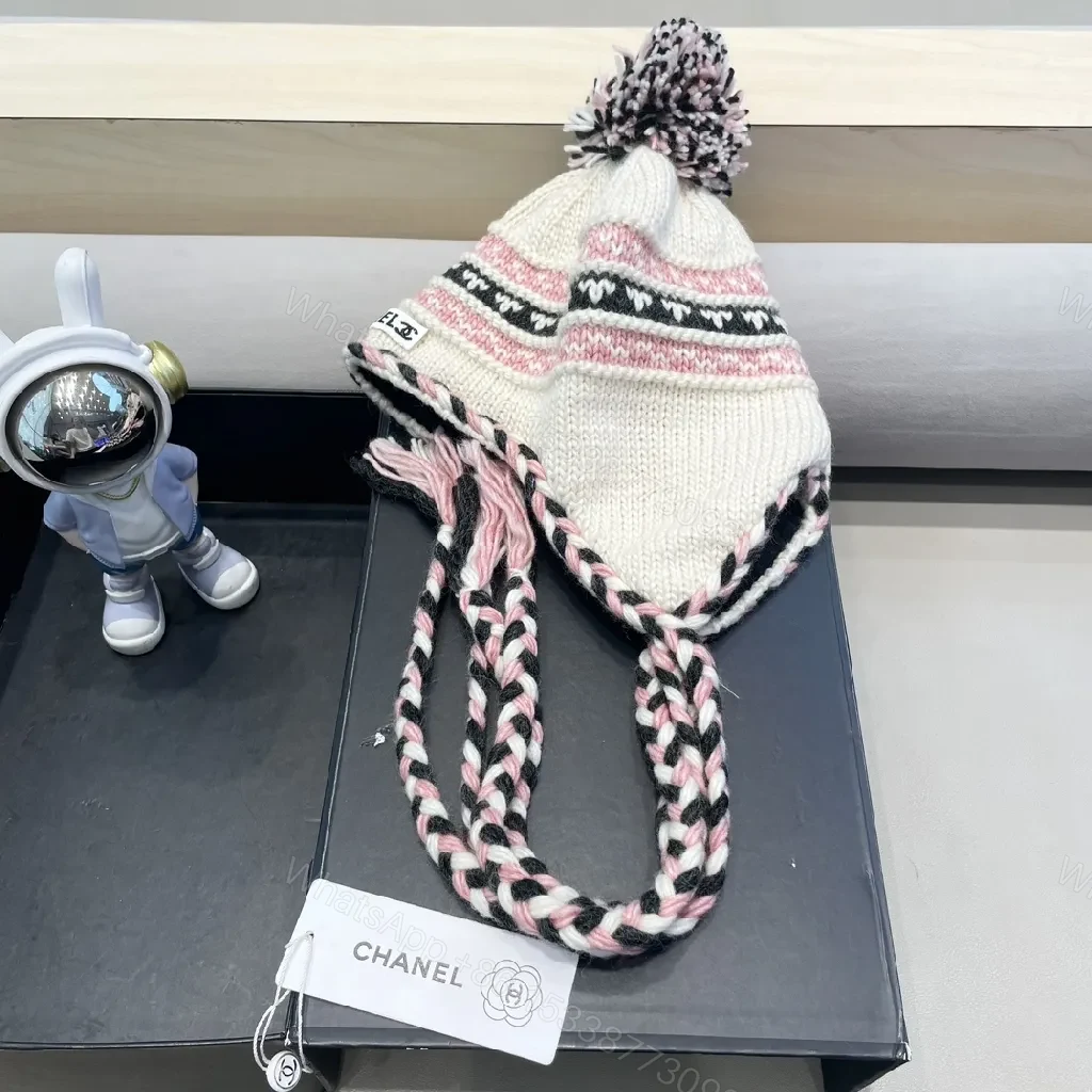 View 4 of Chic Knit Pom Beanie with Braided Tie-Through Straps