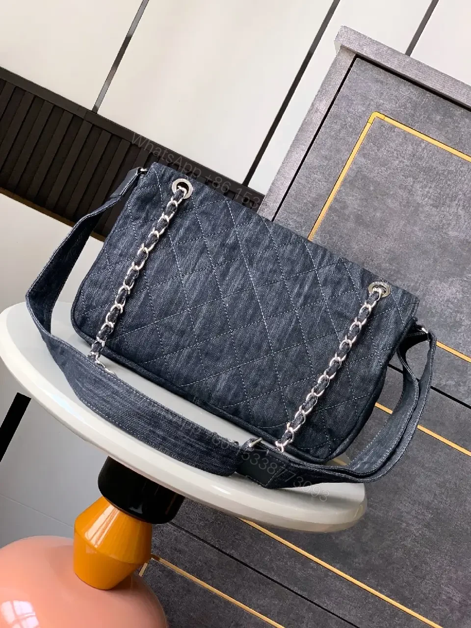 View 6 of Denim Quilted Flap Bag with Signature Chain Closure