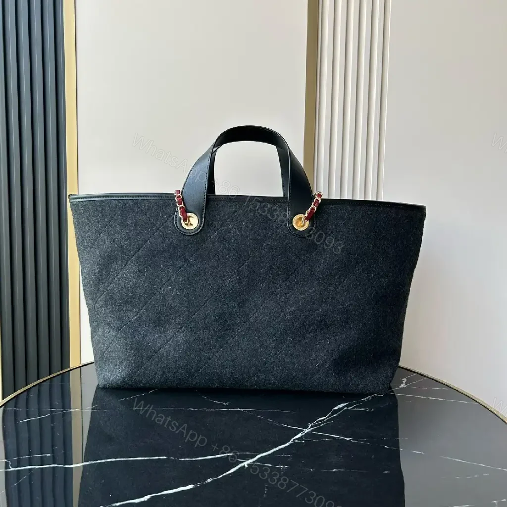 View 3 of Chic Black Quilted Tote with Gold Hardware - Luxury Everyday tote