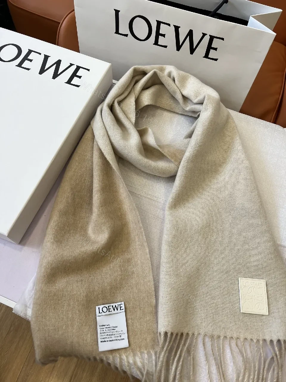Neutral Wool-Blend Scarf: Subtle Pattern, Elegant Fringe — view 1