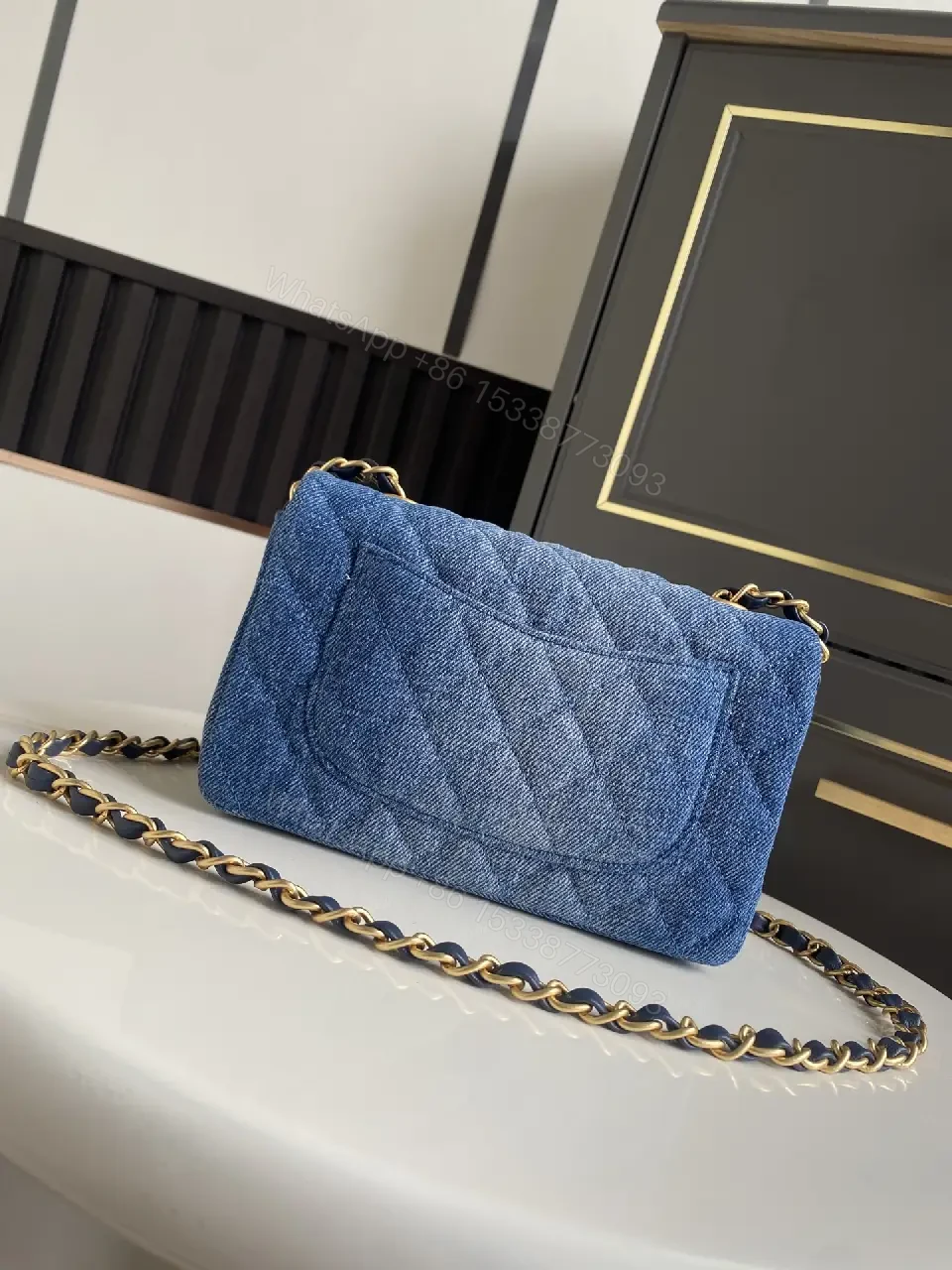 View 5 of Light Blue Denim Quilted Flap Bag with Gold CC Chain Strap