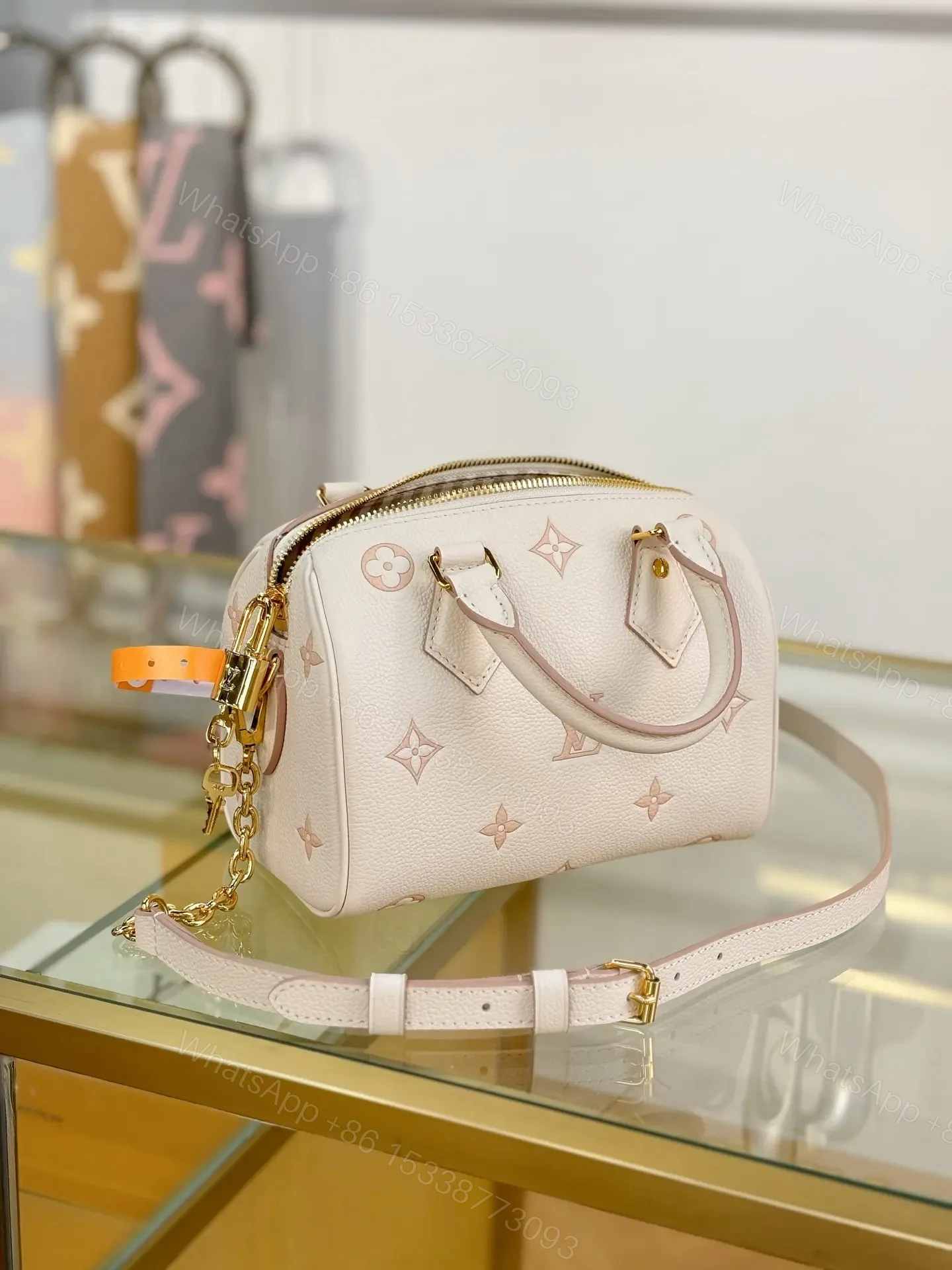 View 2 of Louis Vuitton Monogram Empreinte Bicolor Speedy Bandoulière 20