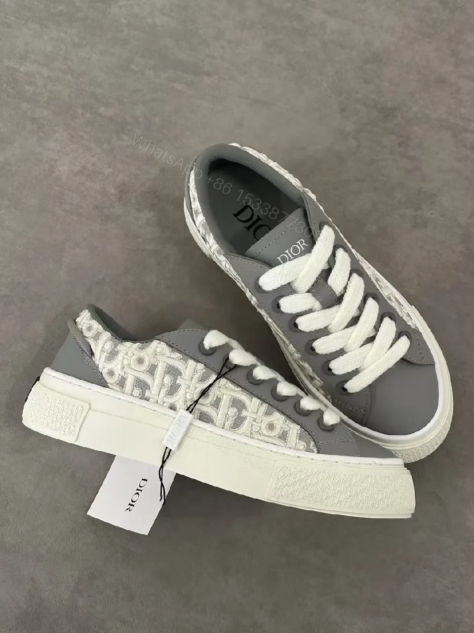 View 7 of Gray Leather Sneaker with Monogram Pattern, Luxurious Texture, Casual High-Tops