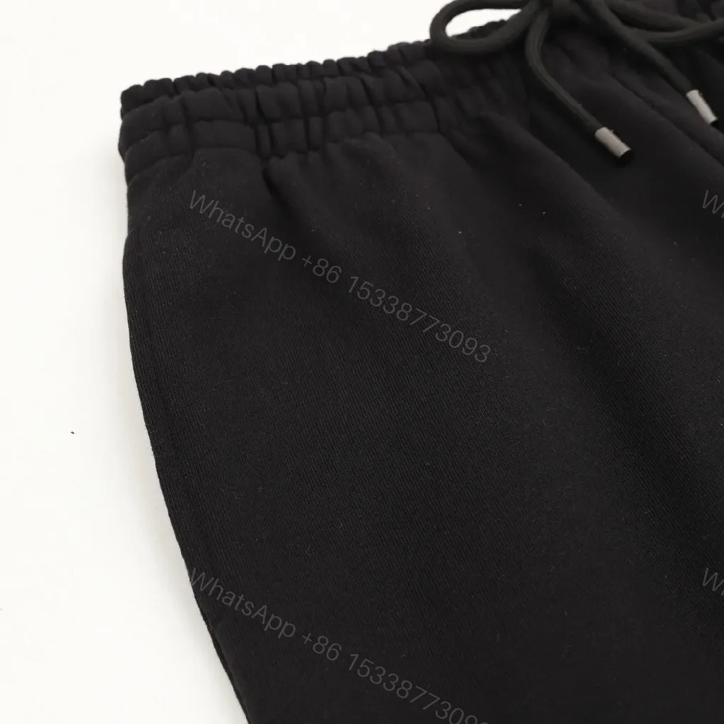 View 6 of Minimalist Black Sweatpants – Premium Comfort, Signature Logo Joggers