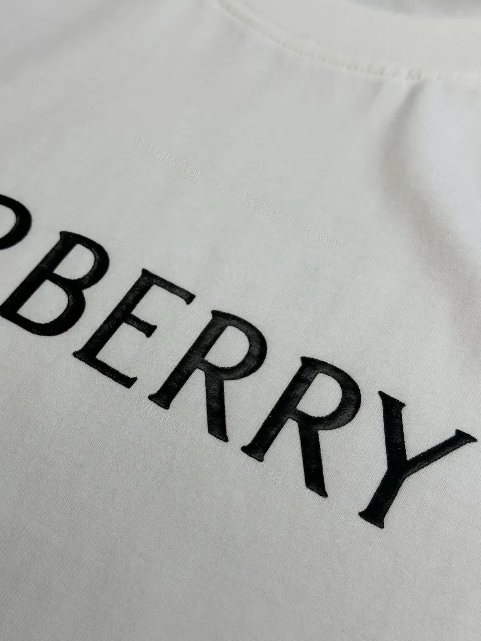View 5 of Minimalist Burberry-Style White Cotton Tee: Elevated Everyday Comfort