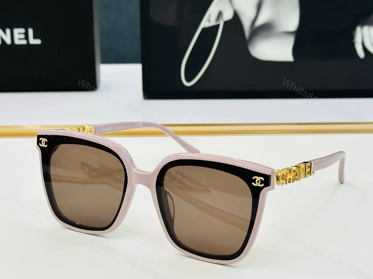 View 2 of Bold Black Frame Sunglasses with Gold Detailing