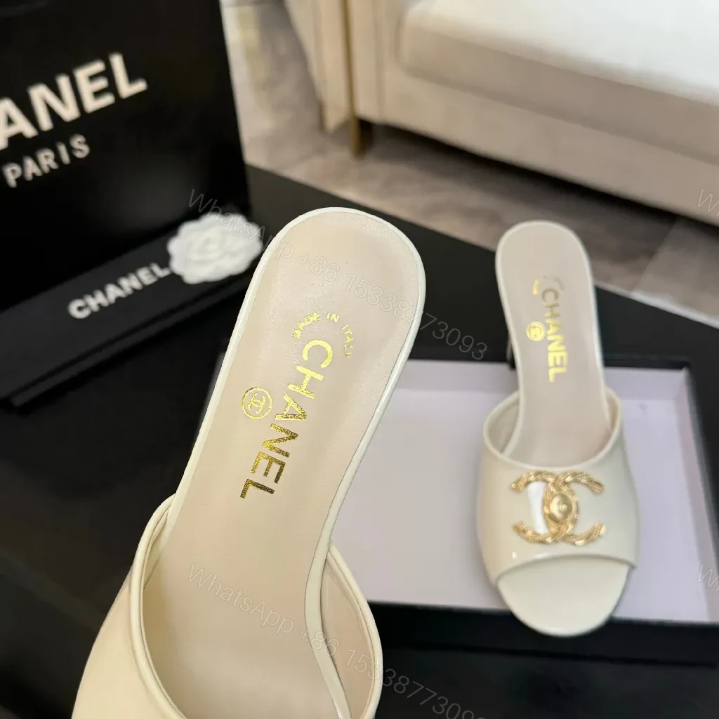 View 6 of White Patent Mules with Gold Logo Embellishment – Sleek Luxury Footwear