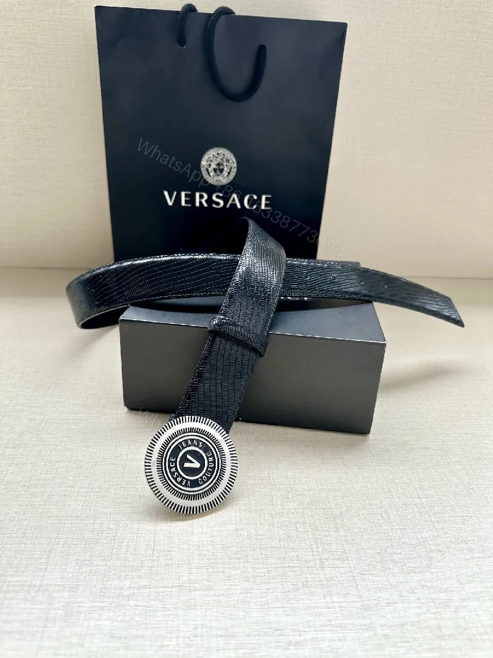 View 6 of Textured Leather Belt with Round Emblem Buckle – Luxe Minimalist Style