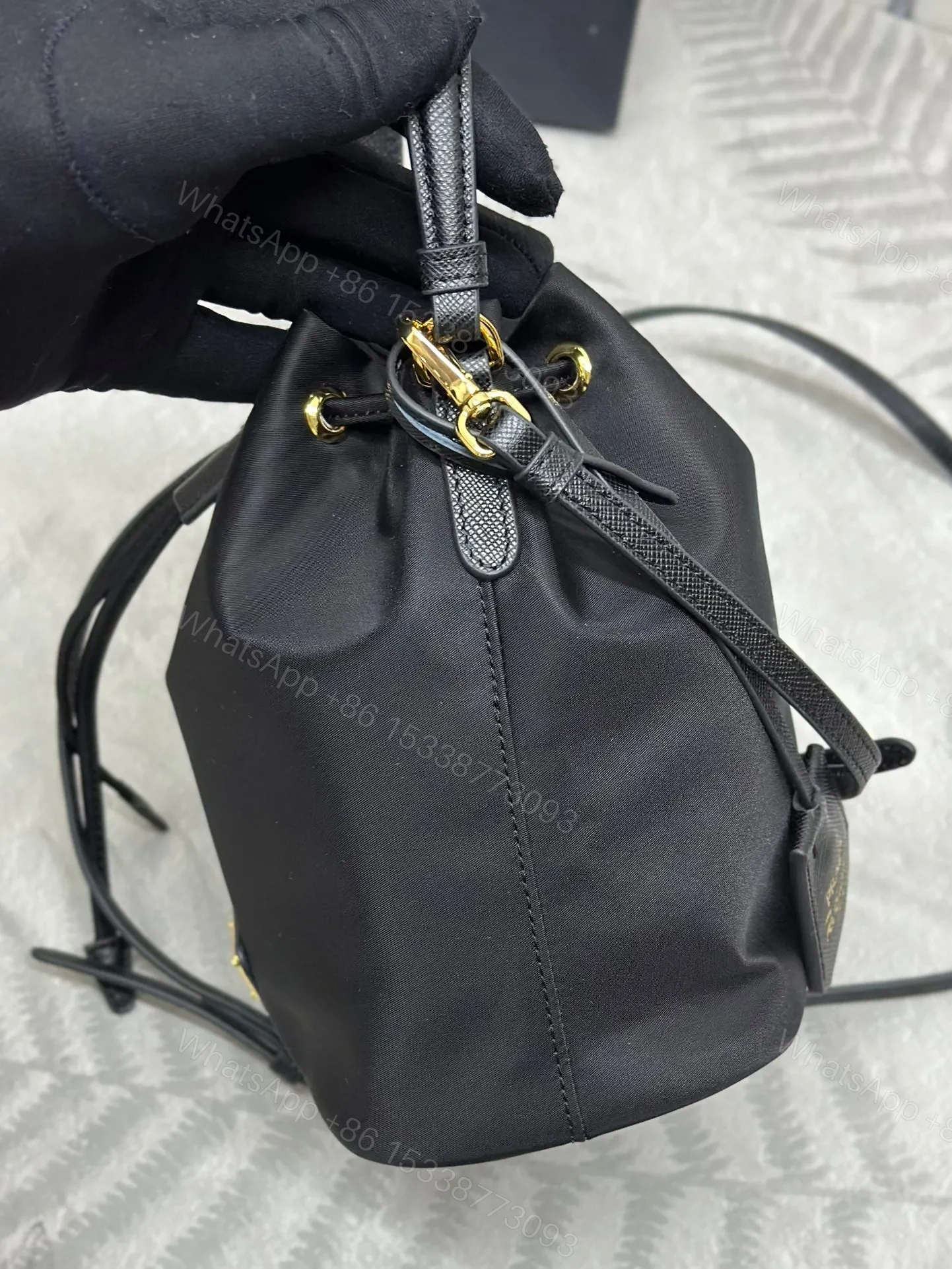 View 7 of BUCKET BAG 19 IN BLACK RE-NYLON AND CALFSKIN HANDLE