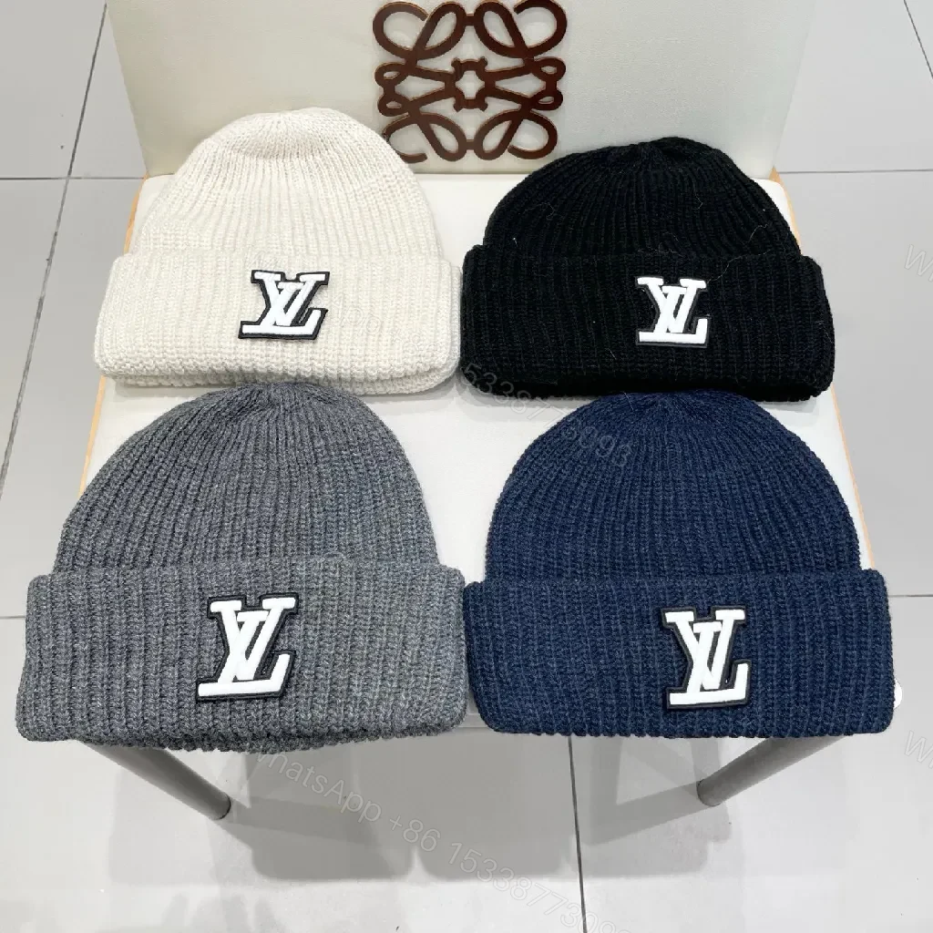 View 6 of Cozy Black Knit Beanie with Subtle Emblem Detail