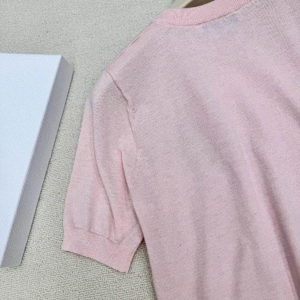 View 11 of Soft Pink Knit Top with Crest – Elegant Everyday Essential