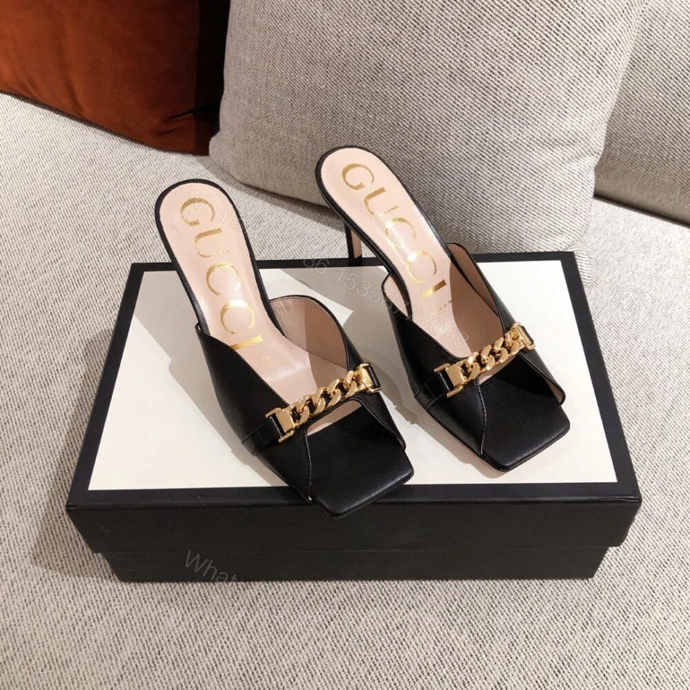 View 2 of Gucci Sylvie Chain Mule Sandals Black