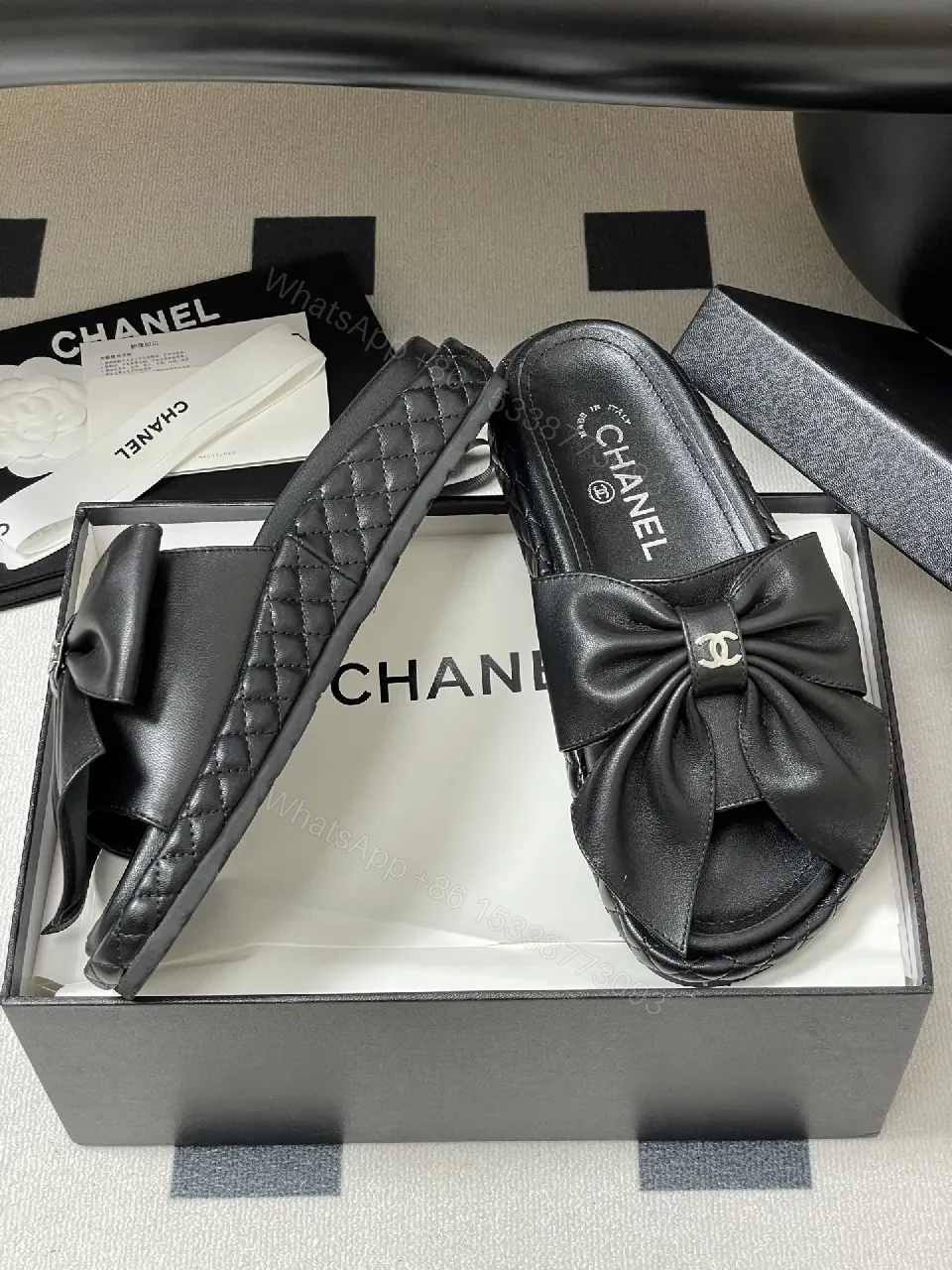 View 4 of Chic Black Quilted Slides with Bow Detail - Luxury Casual Platform