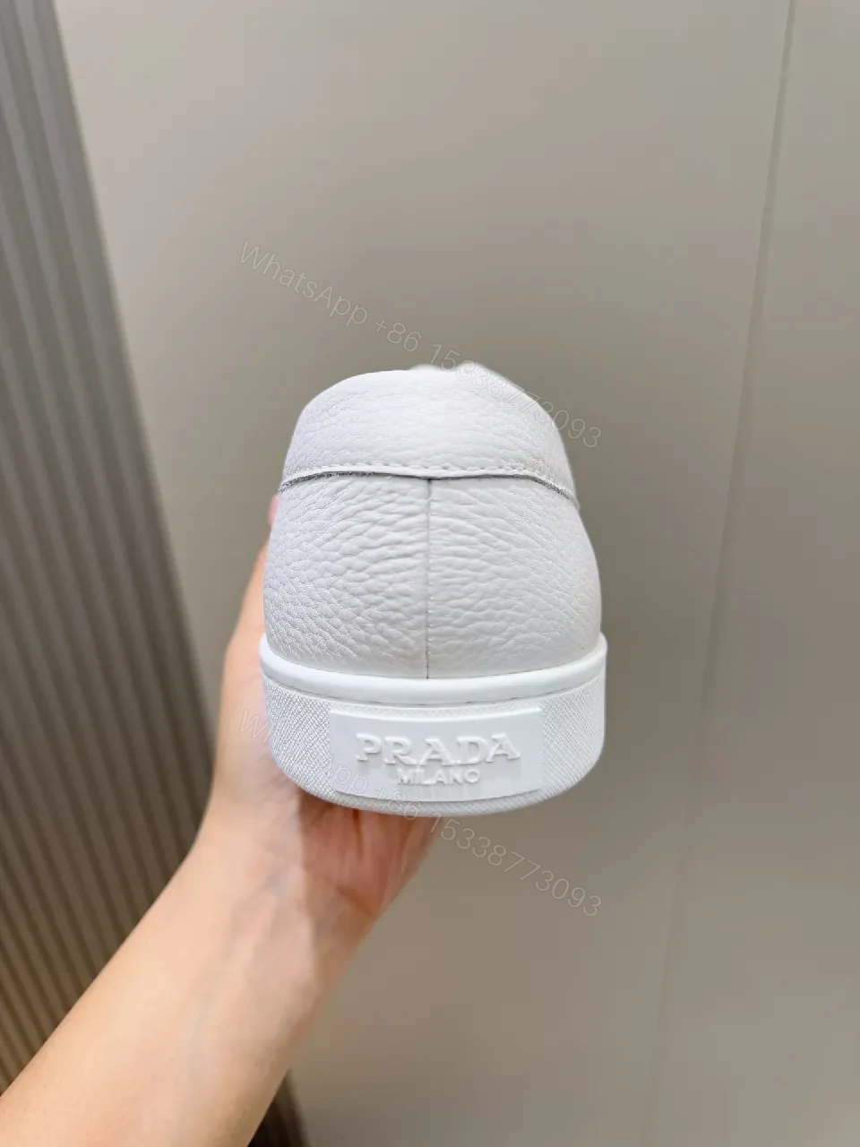 View 3 of Minimalist White Leather Low-Top Sneakers with Subtle Luxury Details