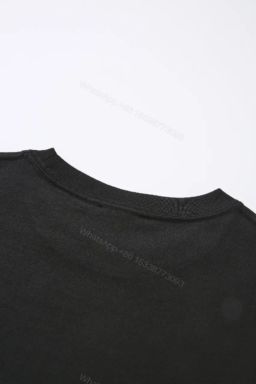 View 10 of Minimalist Black Cotton Tee with Subtle Embossed Logo - T‐Shirt