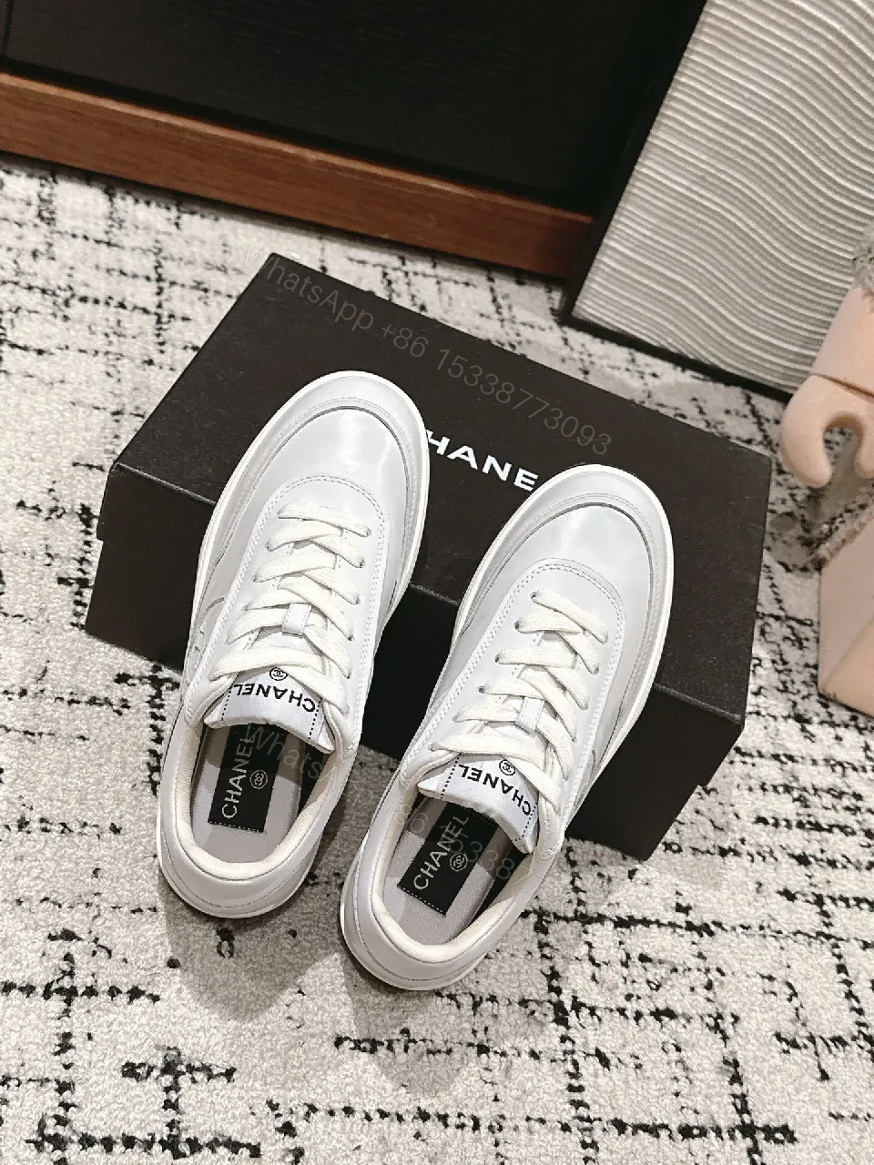 View 6 of Minimalist White Leather Sneakers with Subtle Chanel Detailing