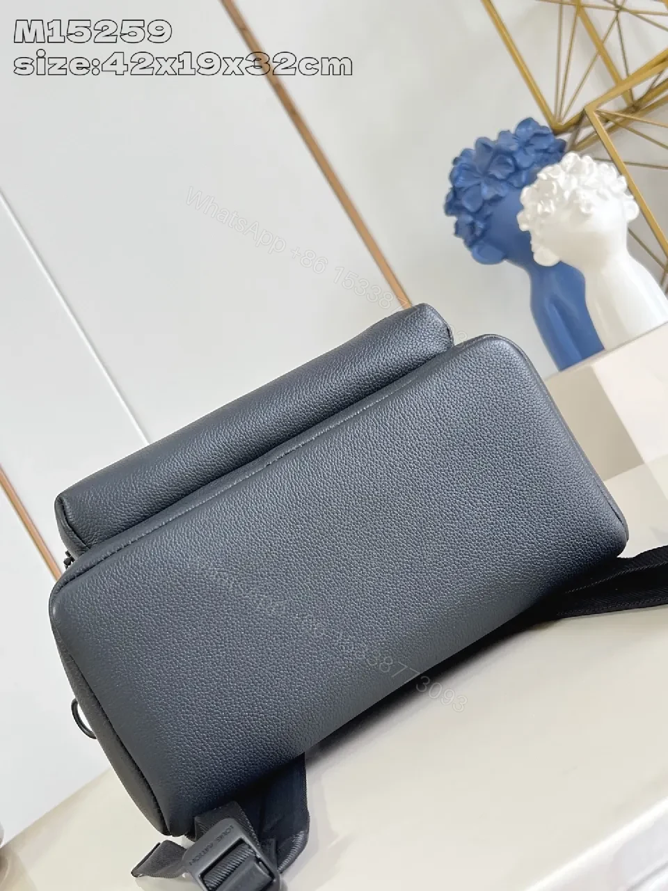 View 4 of Gray Leather Compact Backpack: Minimalist Luxury, Subtle Branding, Everyday Organizer