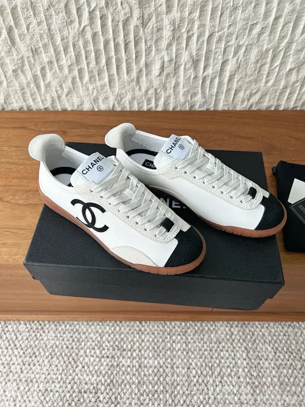 Chic Monochrome Leather-Accent Luxury Sneaker, Low-Top — view 1