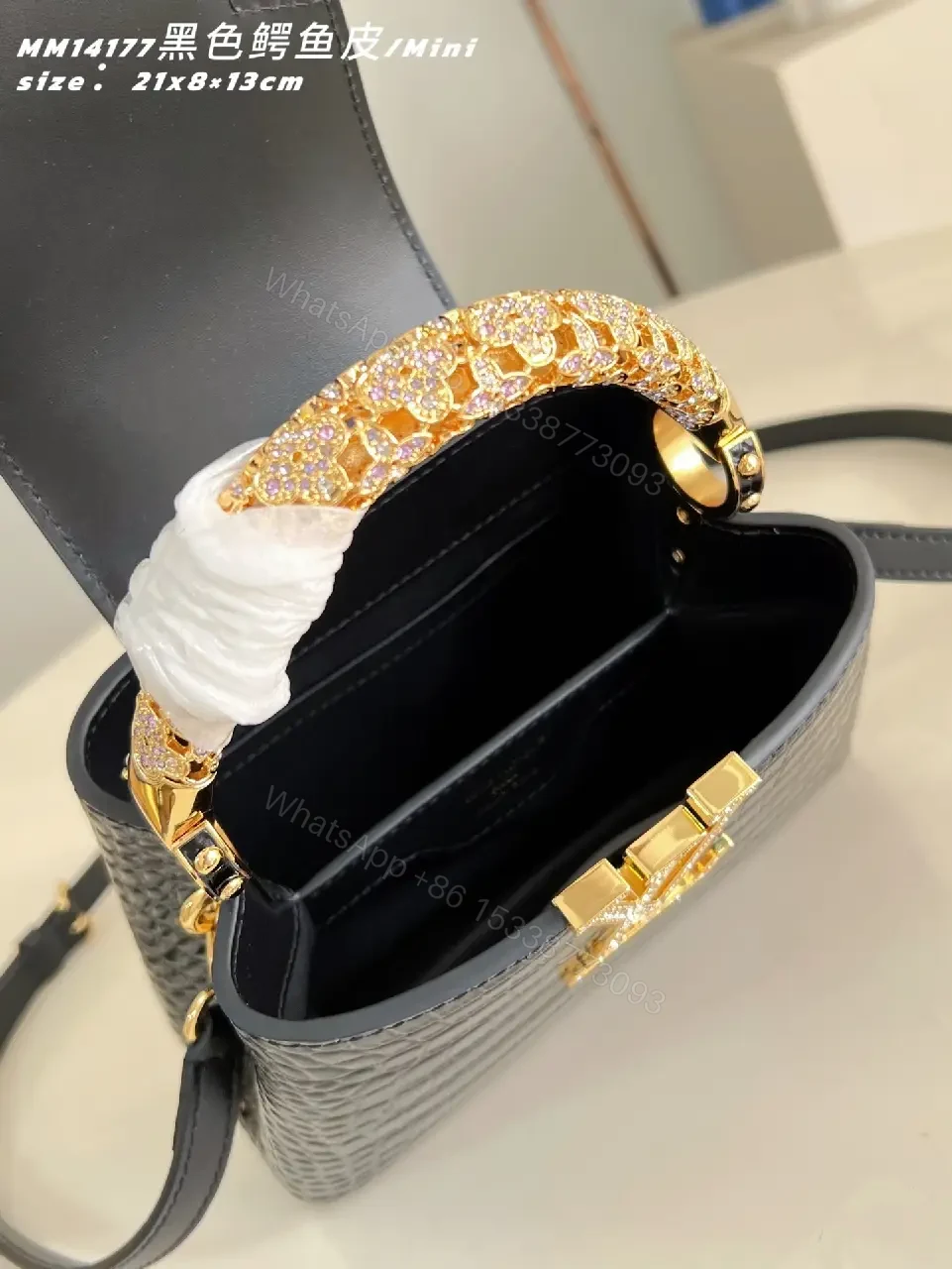 View 2 of Crocodile-Texture Mini Bag with Gold Emblem – Luxe Everyday Glam