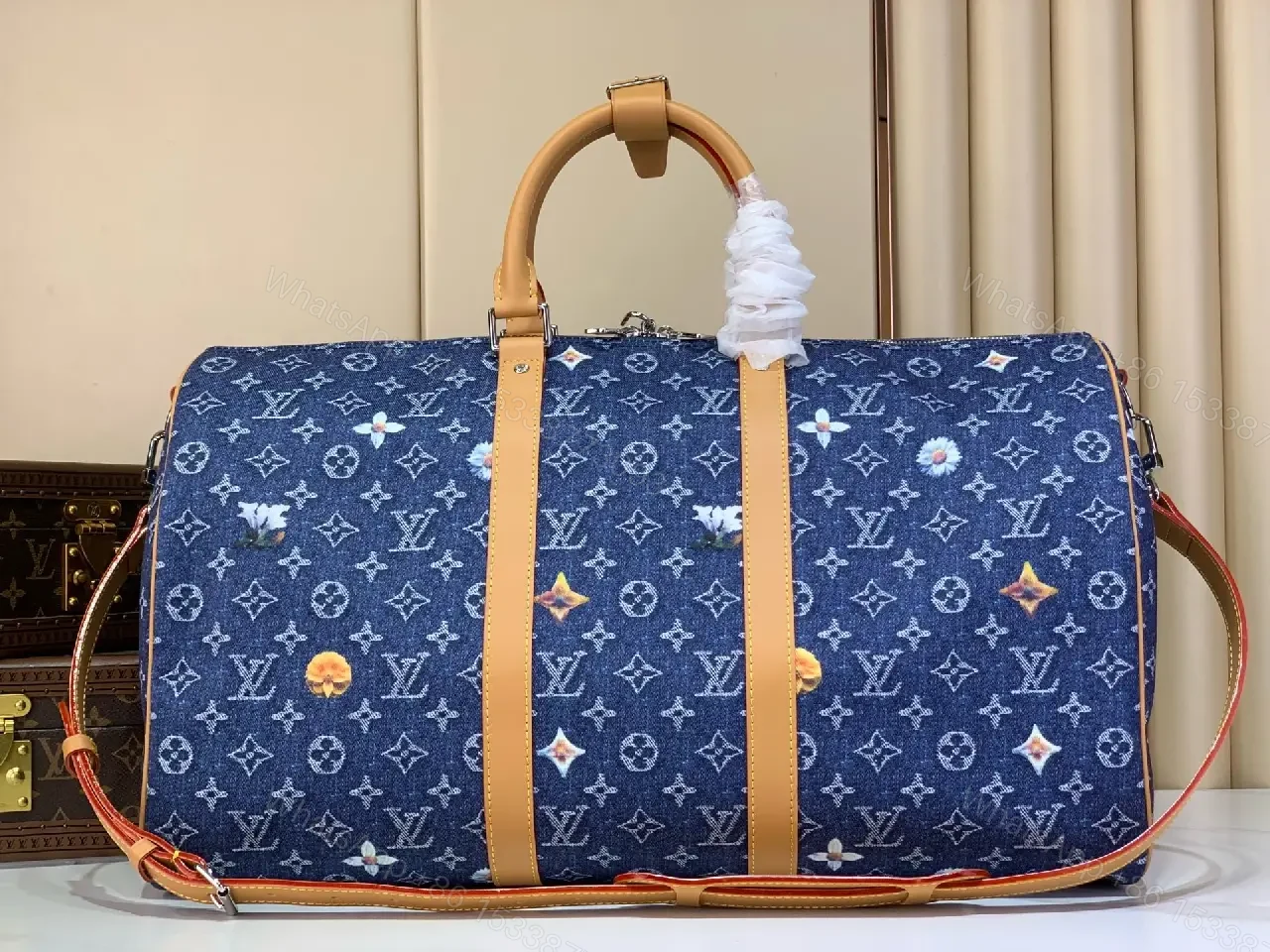 View 4 of Blue denim monogram-print travel bag with tan leather trim for luxury weekends