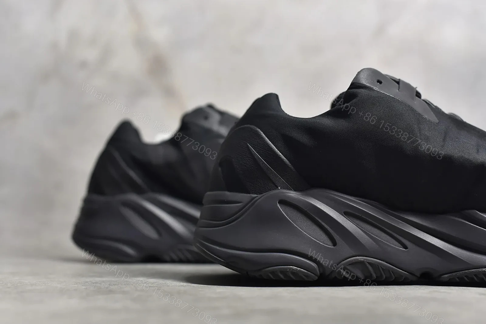 View 4 of Adidas Yeezy Boost 700 MNVN “Triple Black” Reps