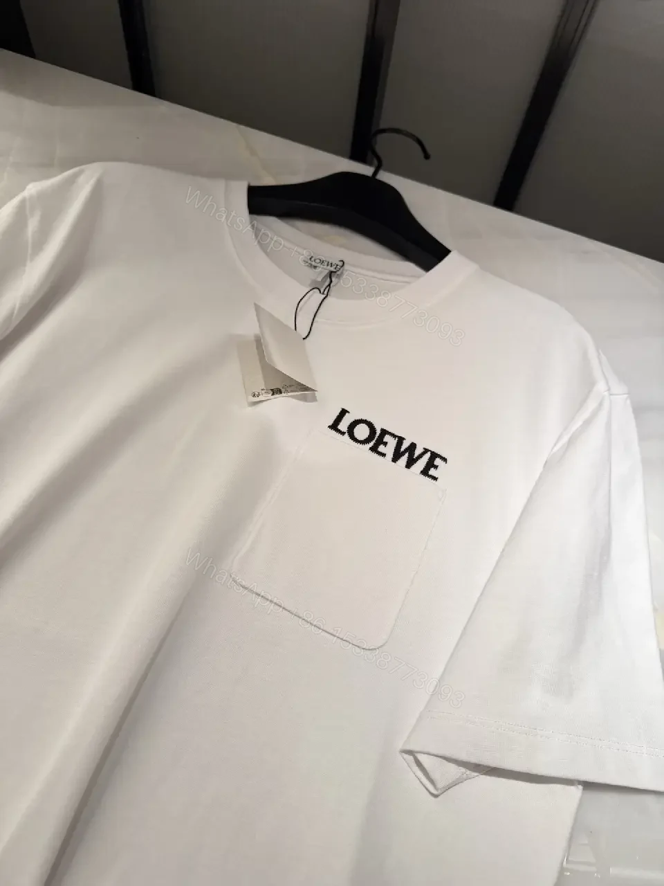 View 5 of Minimalist White Tee with Structured Pocket & Logo Emblem
