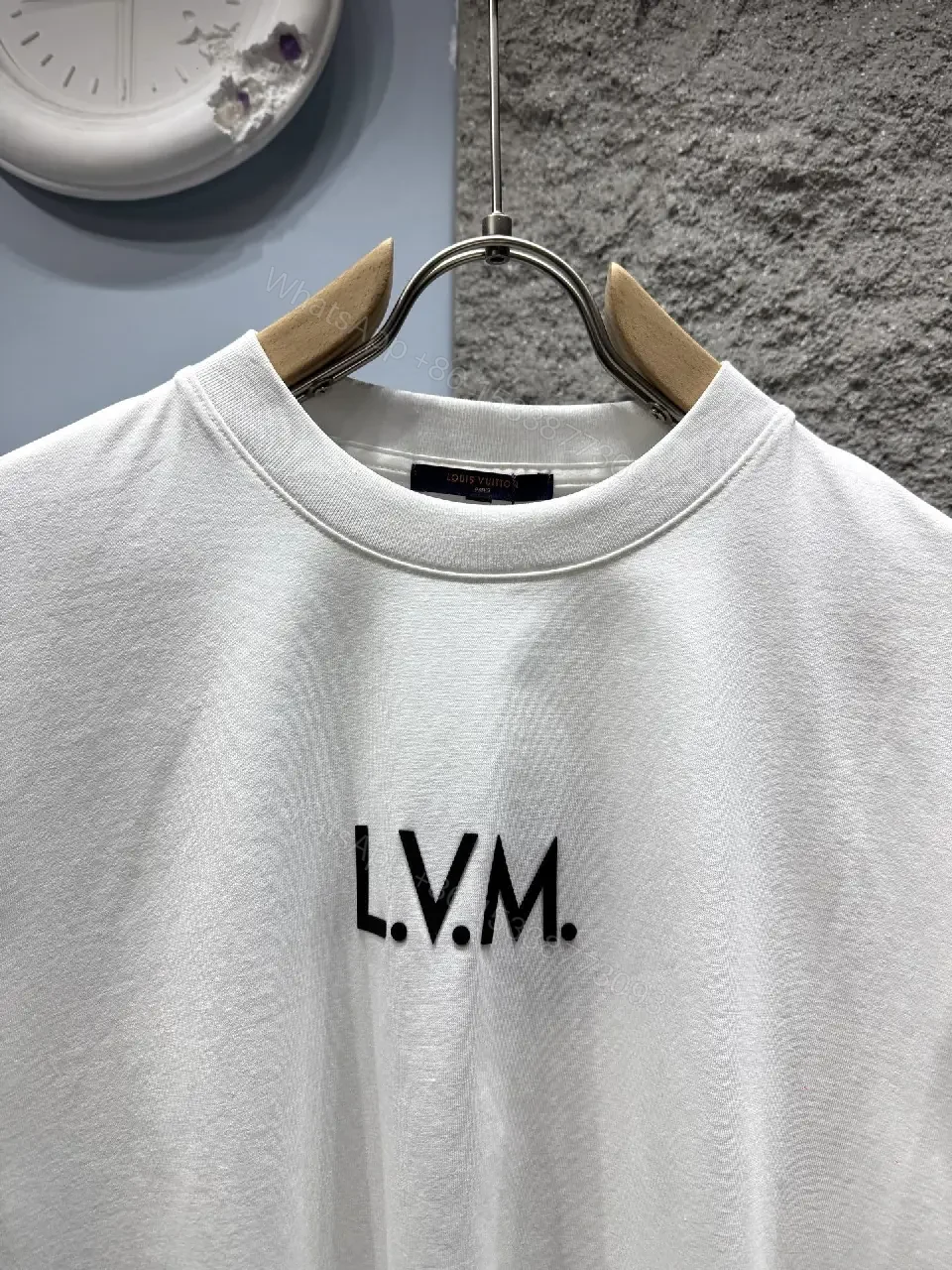 View 2 of Minimalist White T-Shirt with Subtle LV.M Emblem - Premium Cotton