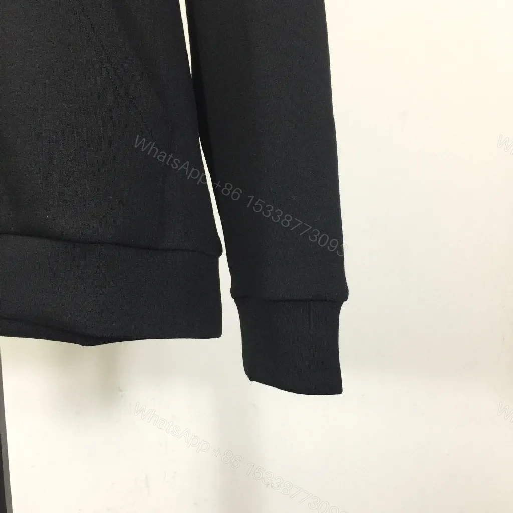 View 2 of Minimalist Black Hoodie with Gold Logo – Premium Casual Wear