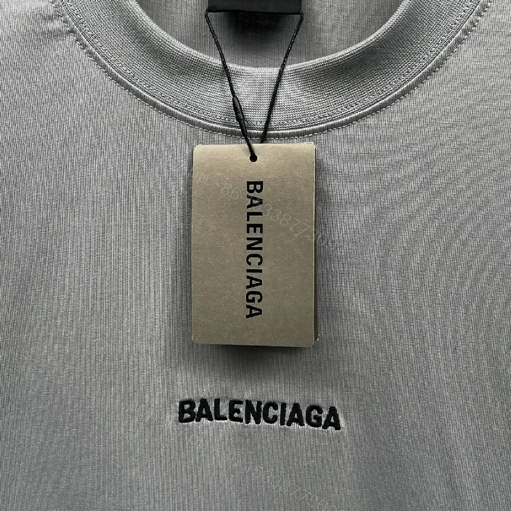 View 3 of Neutral Cotton Oversized Tee: Minimal Logo, Elevated Comfort
