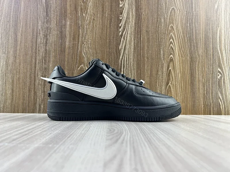 View 10 of Black Leather Low-Top Sneakers with White Swoosh - Luxury Streetwear