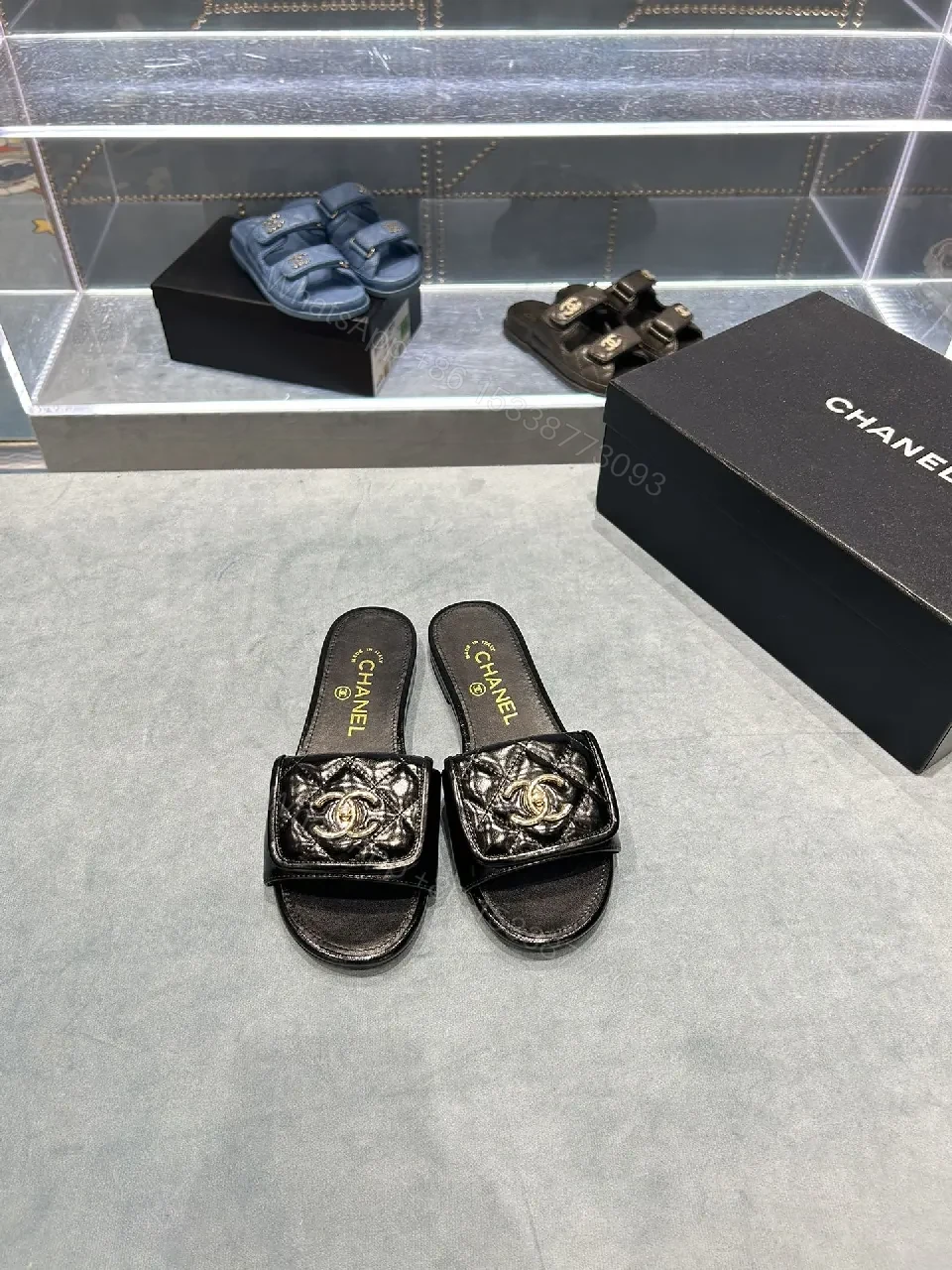 View 4 of Black Quilted Leather Slide with Gold Logo Escort
