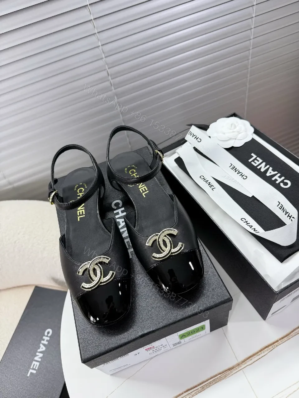 View 7 of Black Satin-Patent Slingback Flats with Gold Logo Hardware