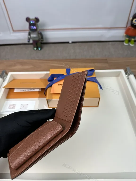 View 2 of Monogram Leather Wallet: Classic Louis Vuitton Bi-Fold, Slim Profile