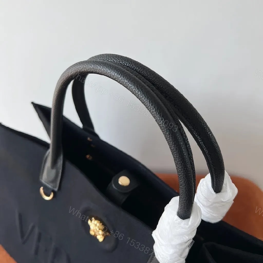 View 8 of Structured Sophistication Tote: Black, Matte Shell, Modern Luxury, Gold Hardware