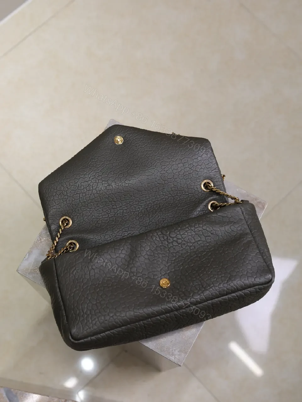 View 5 of Textured Leather Envelope Bag: Black + Gold Accent, Compact Luxury Shoulder Bag