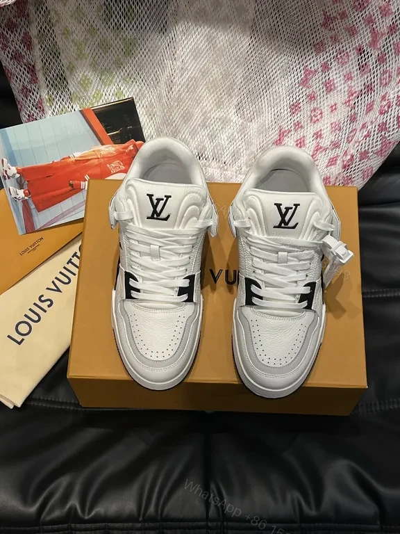 White Leather High-Top Sneakers with LV Branding and Visible Hardware — view 1