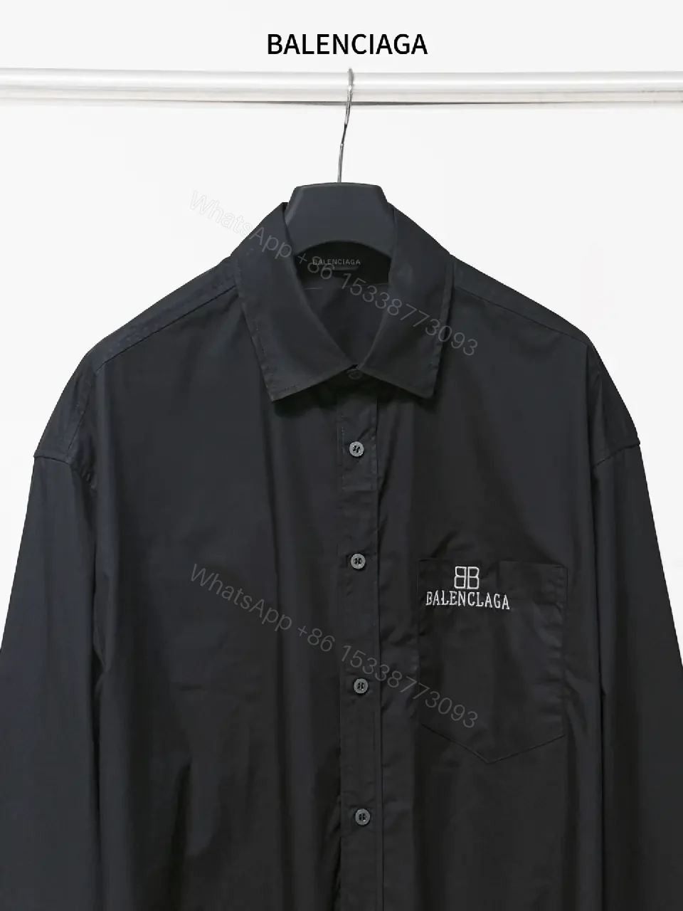 View 5 of Structured Minimalist Button-Front Shirt with Subtle Crest, Black