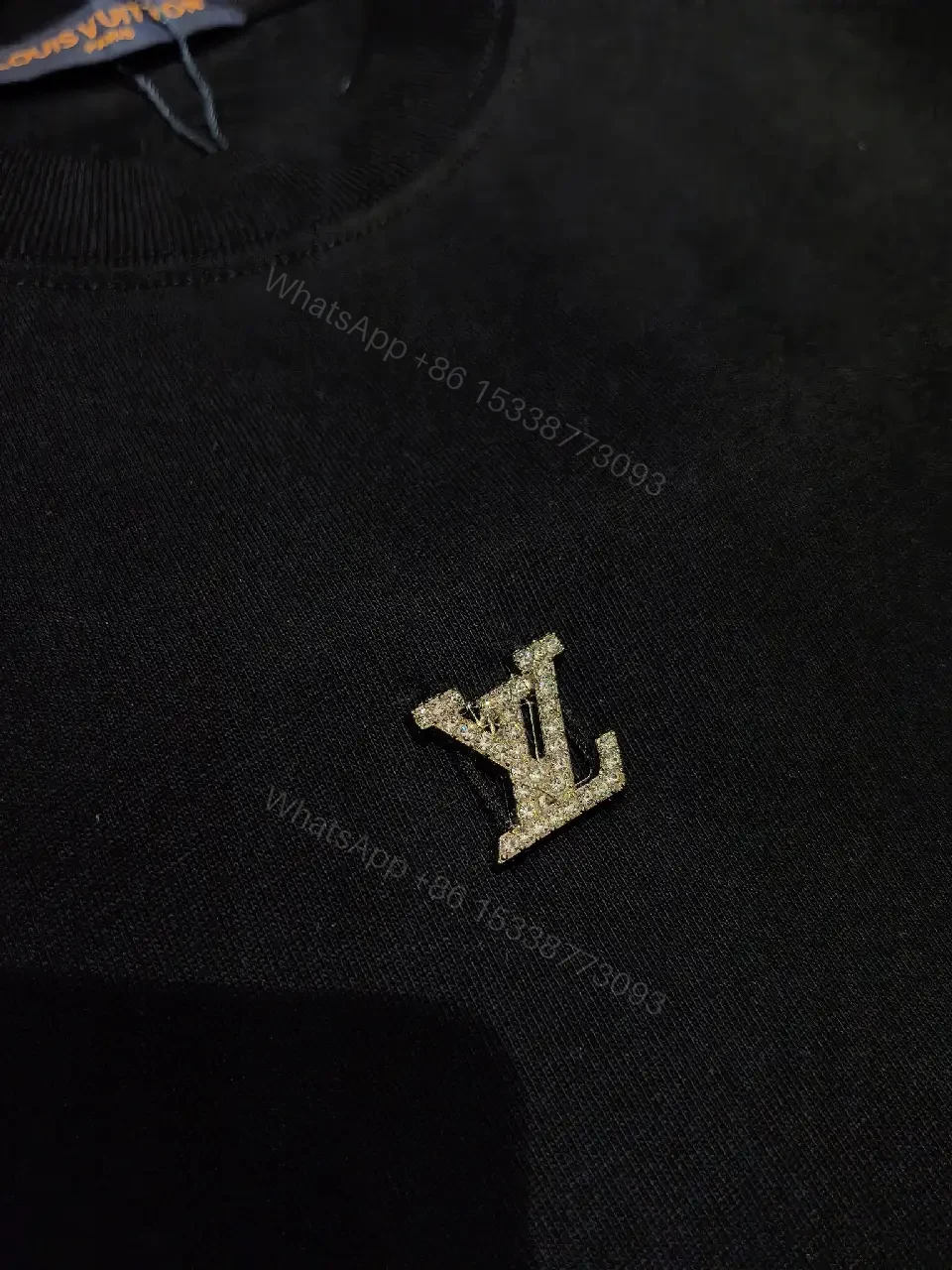 View 2 of Minimalist Black Cotton Tee with Subtle LV Emblem