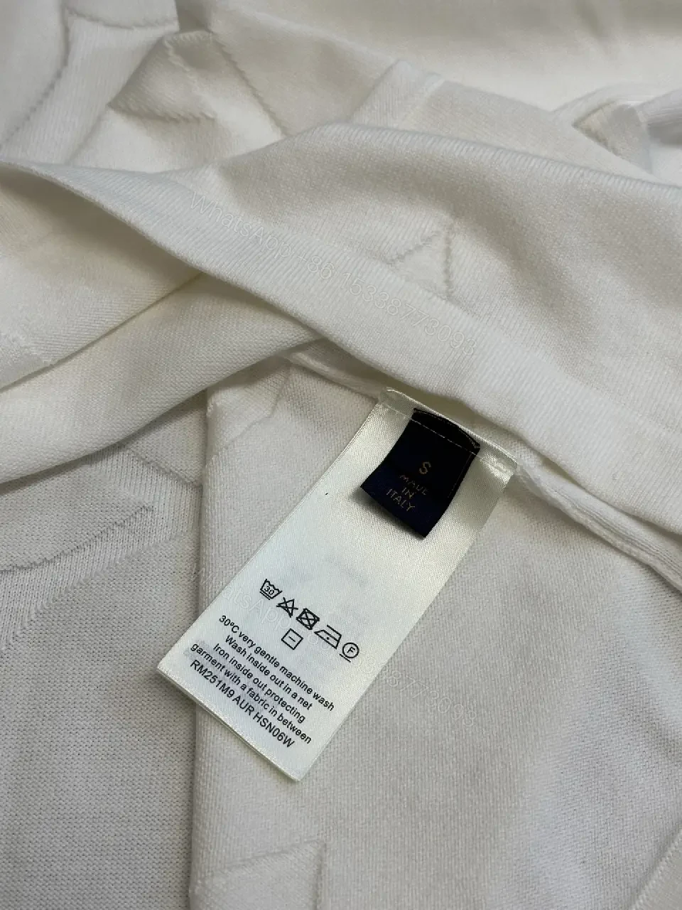 View 11 of Off-White Cream Oversized Tee with Embossed Logo Pattern