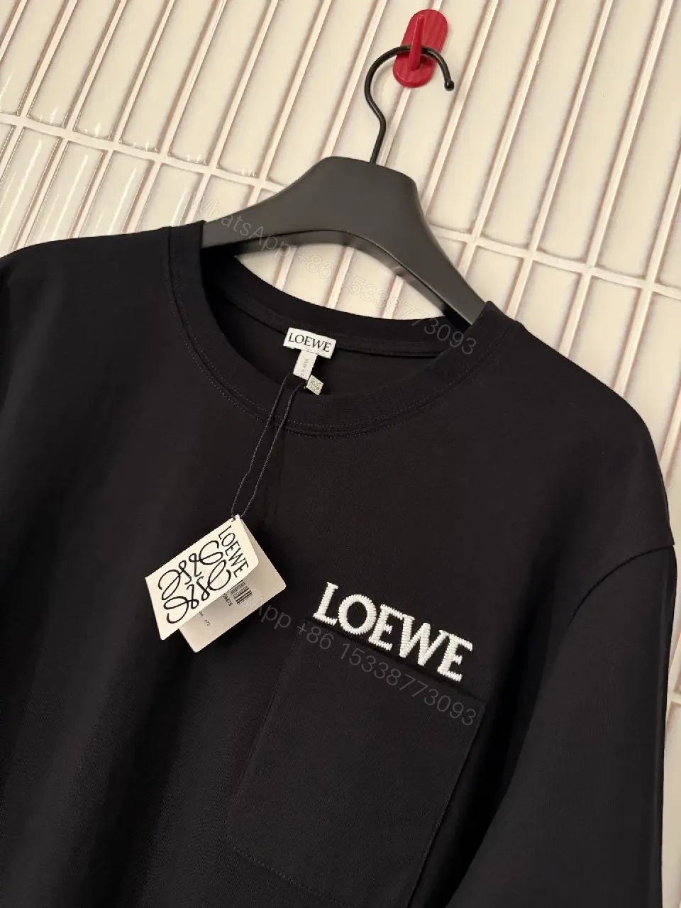 View 6 of Black Cotton Crew Tee with Pocket – Subtle Luxe Comfort