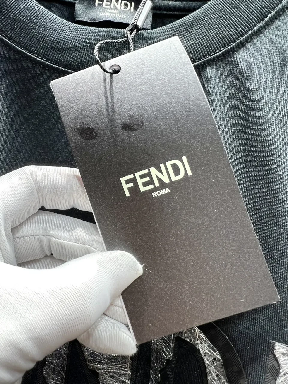 View 2 of Minimalist Black Cotton Tee with Elevated Logo Texture