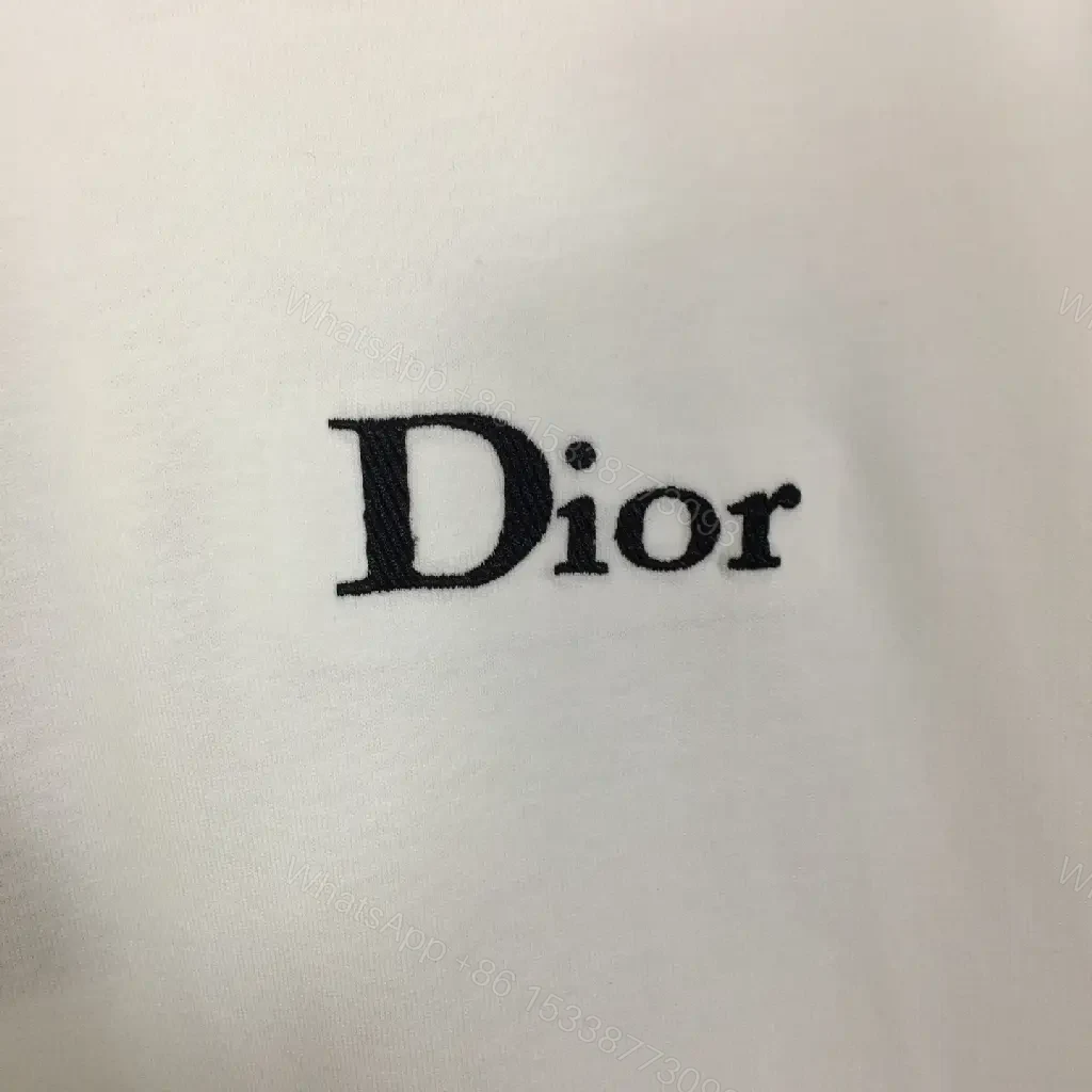 View 2 of Minimalist White Tee: Premium Cotton, Subtle Logo, Classic Fit tee