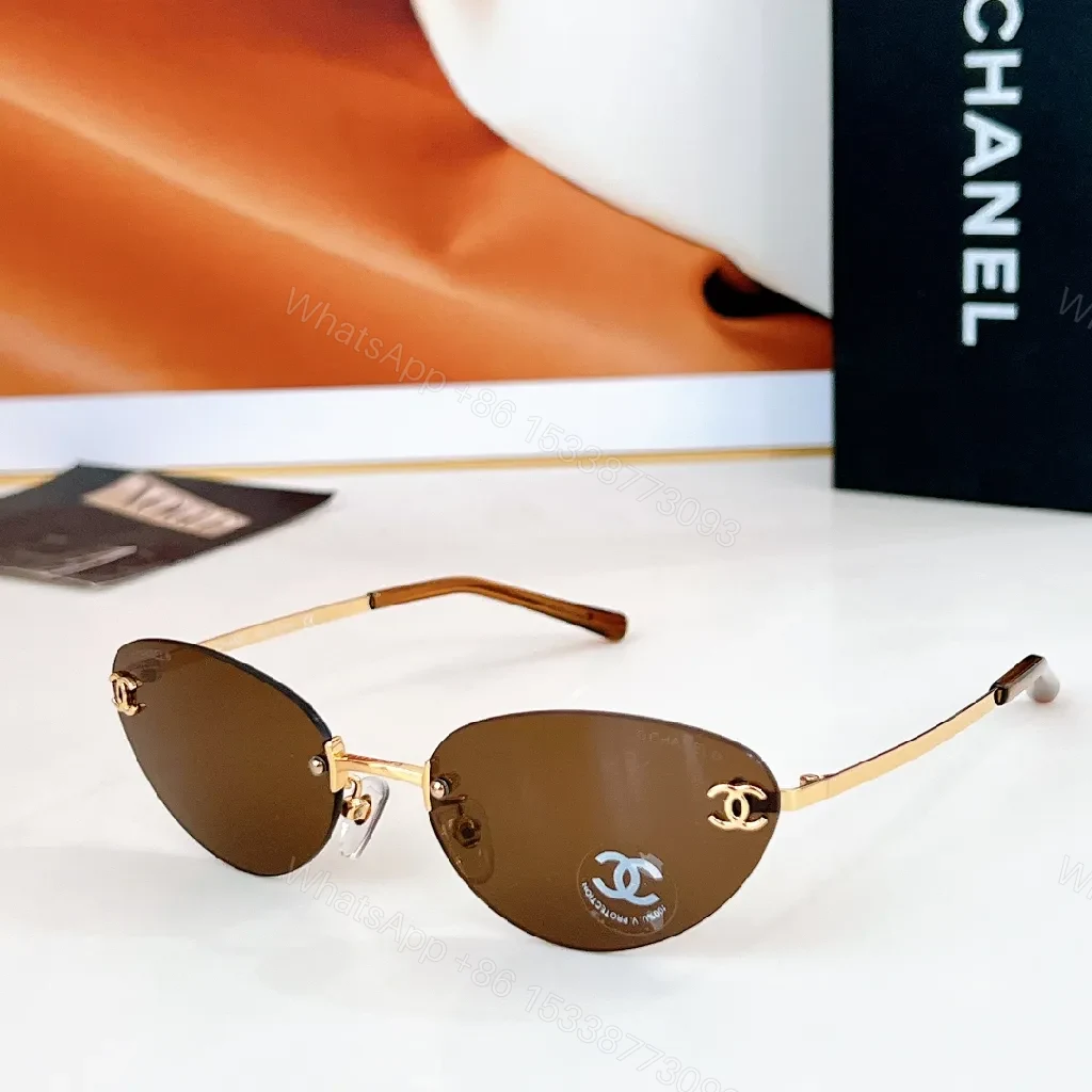 View 3 of Rimless Blue Lens Sunglasses with Gold-Tone Frames