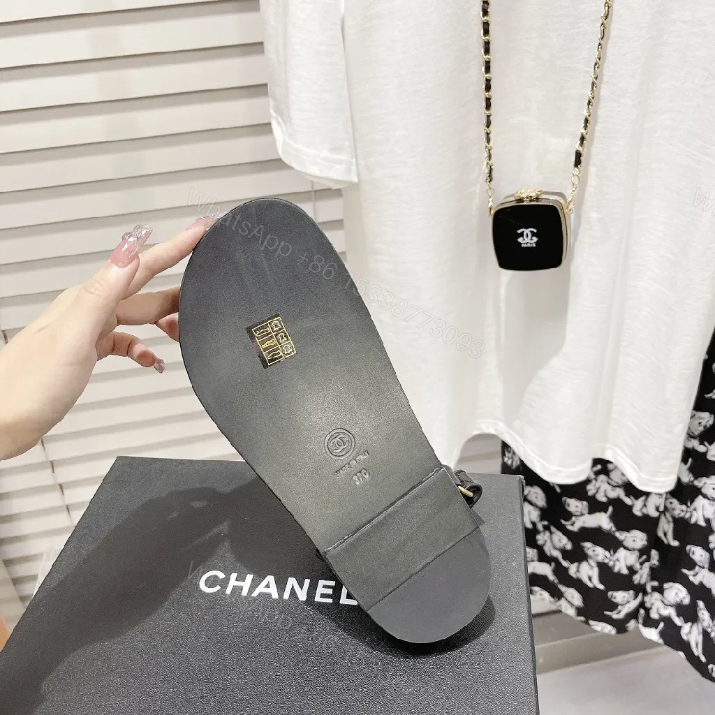 View 9 of Chic Black Leather Sandals with Signature Hardware