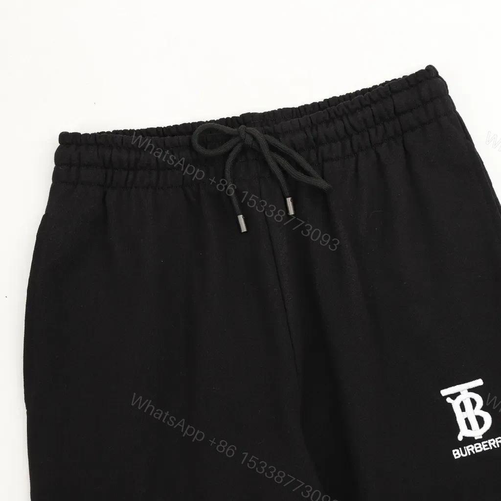 View 5 of Minimalist Black Sweatpants – Premium Comfort, Signature Logo Joggers