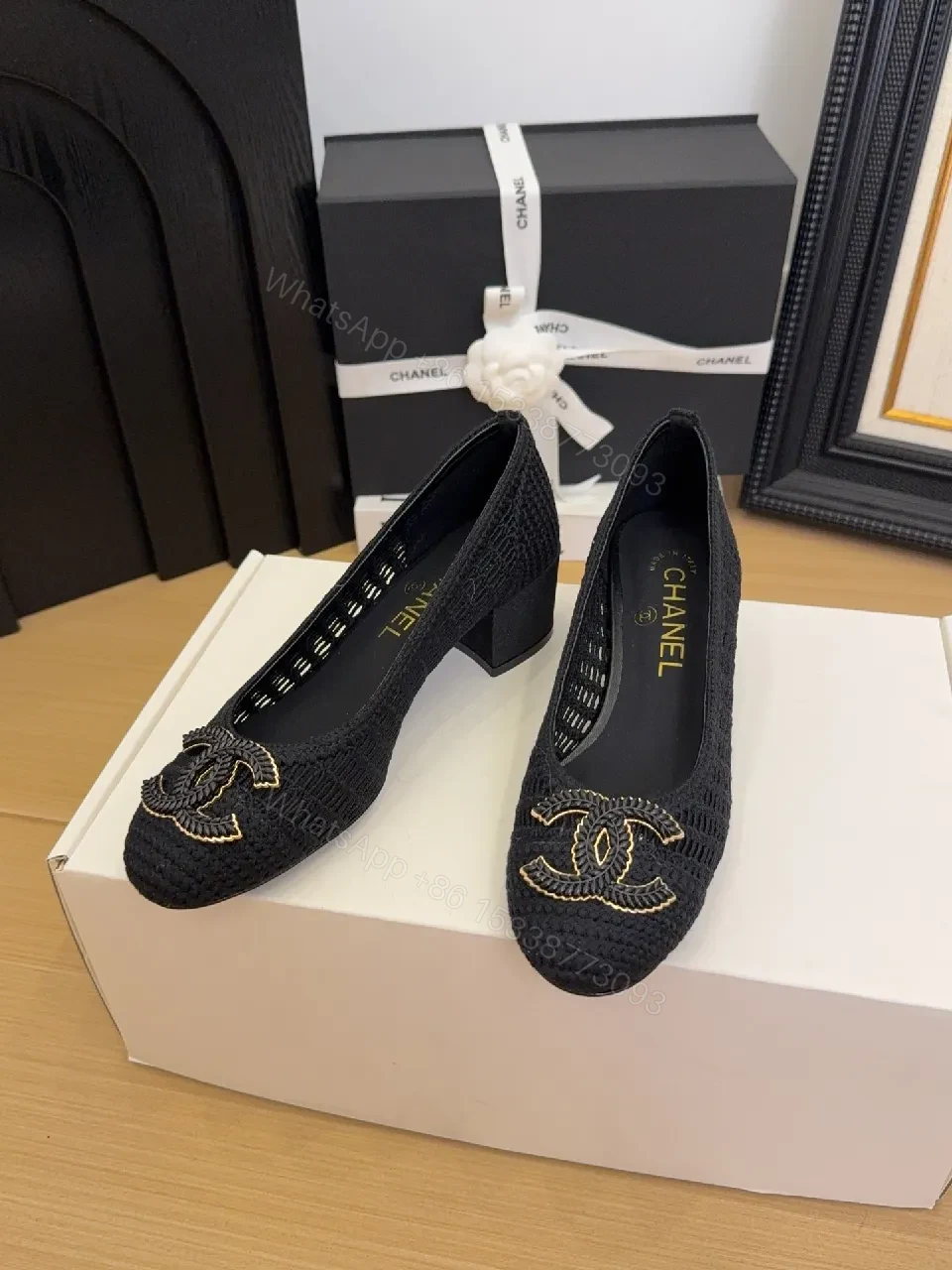 View 4 of Elegant Quilted Black Loafers with Gold Emblem: Everyday Luxury